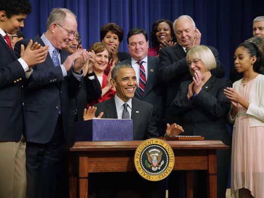 President Obama signing the Every Child Succeeds Act