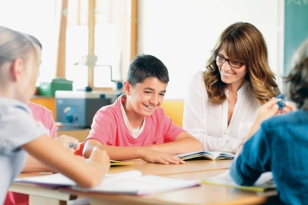 Teacher And Student On A Lesson American Board Blog