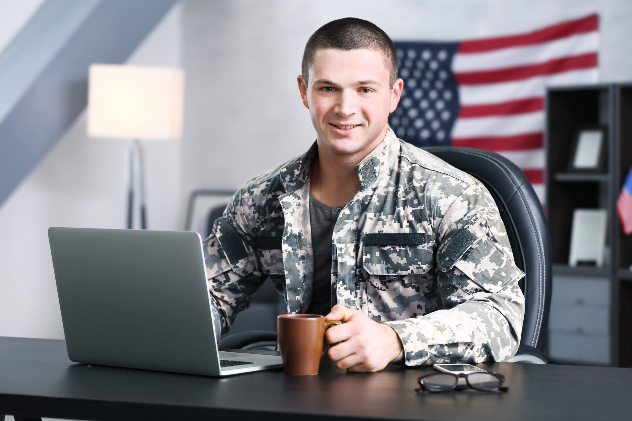 Soldier,Working,With,Laptop,In,Headquarters,Building American Board Blog
